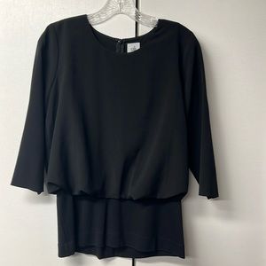 Cabi brand Indulgence Blouse in black. Dressy with slimming stretch waist